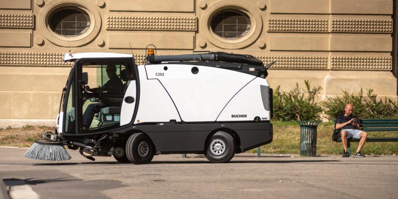 Picture of the Johnston Bucher C202 on a parking area about to sweep the space